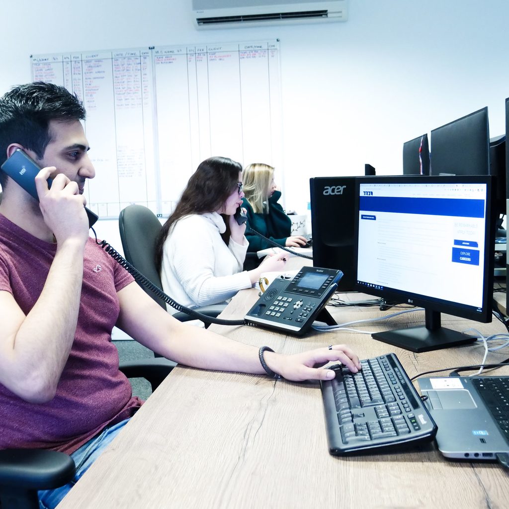 Employees hard at work at their desks