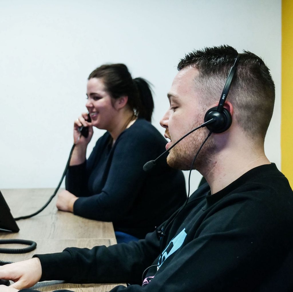Employees sat with their headsets on