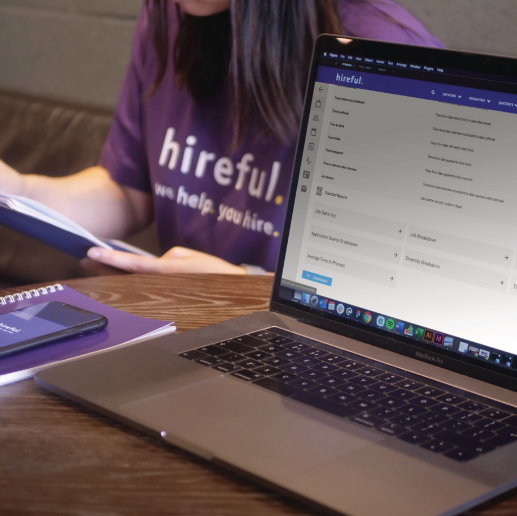 Employee sat behind a computer