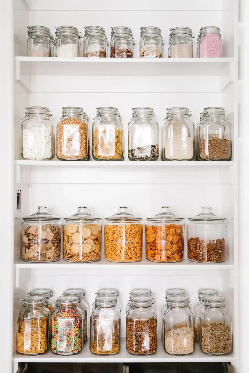 Organized pantry shelves with mason jars