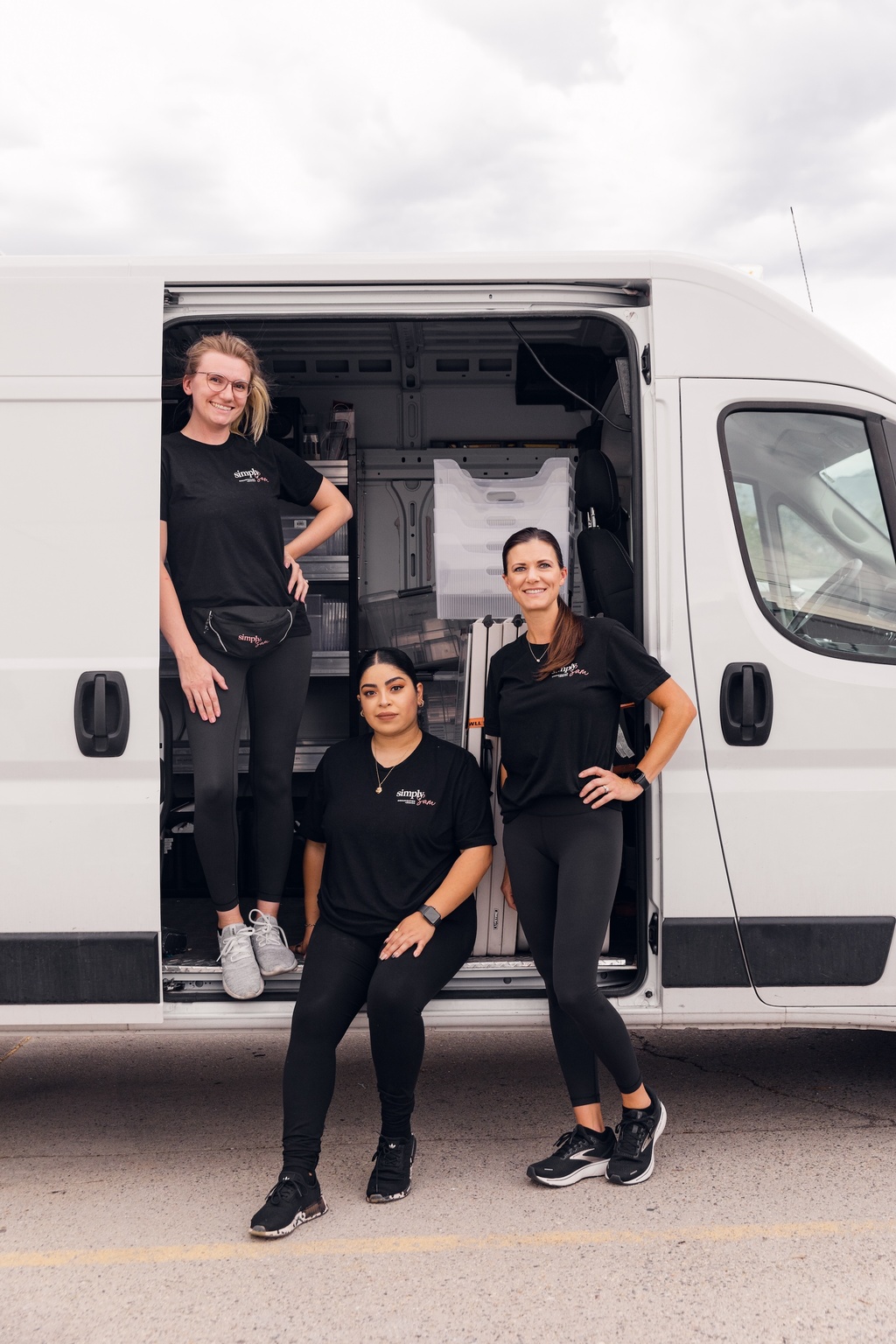 The Simply Sam team standing in front of our moving van