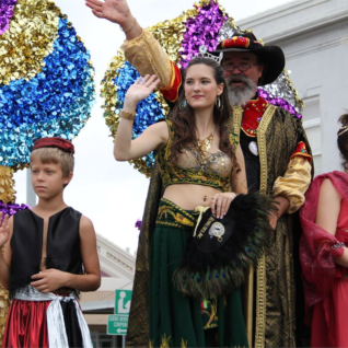 Sultana Oreuc XV Kayla Jones and Sultan Yekrut XV Joe Adams greet the adoring crowds as their Royal Float rolls through the Turkeyfest Parade as part of the 100th Anniversary Cuero Turkey Trot.