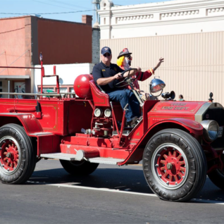 Cuero legend Coco the Clown gets a lift from the Cuero Fire Department.
