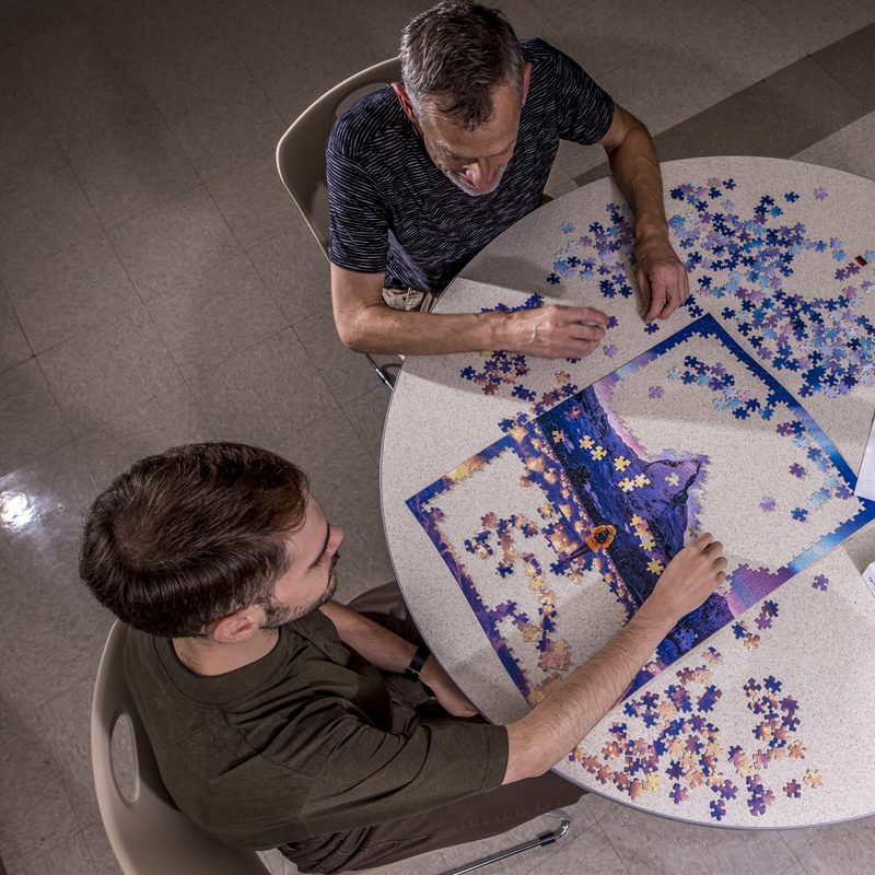 Mockingbird Hill residents building a puzzle
