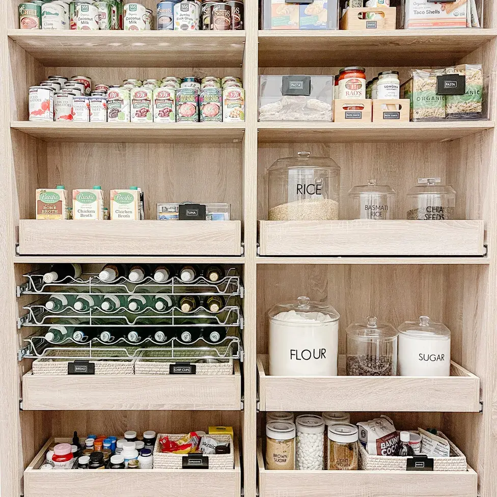 organized pantry with pull out drawers and acrylic bins
